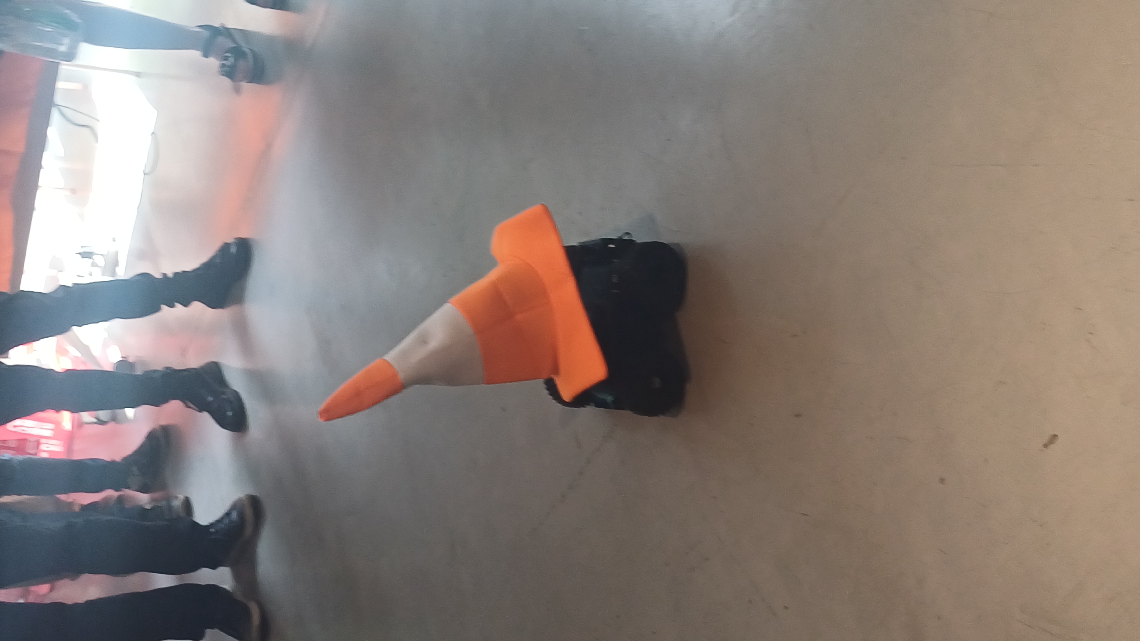 A remote-controlled robot with the VLC cone hat on top